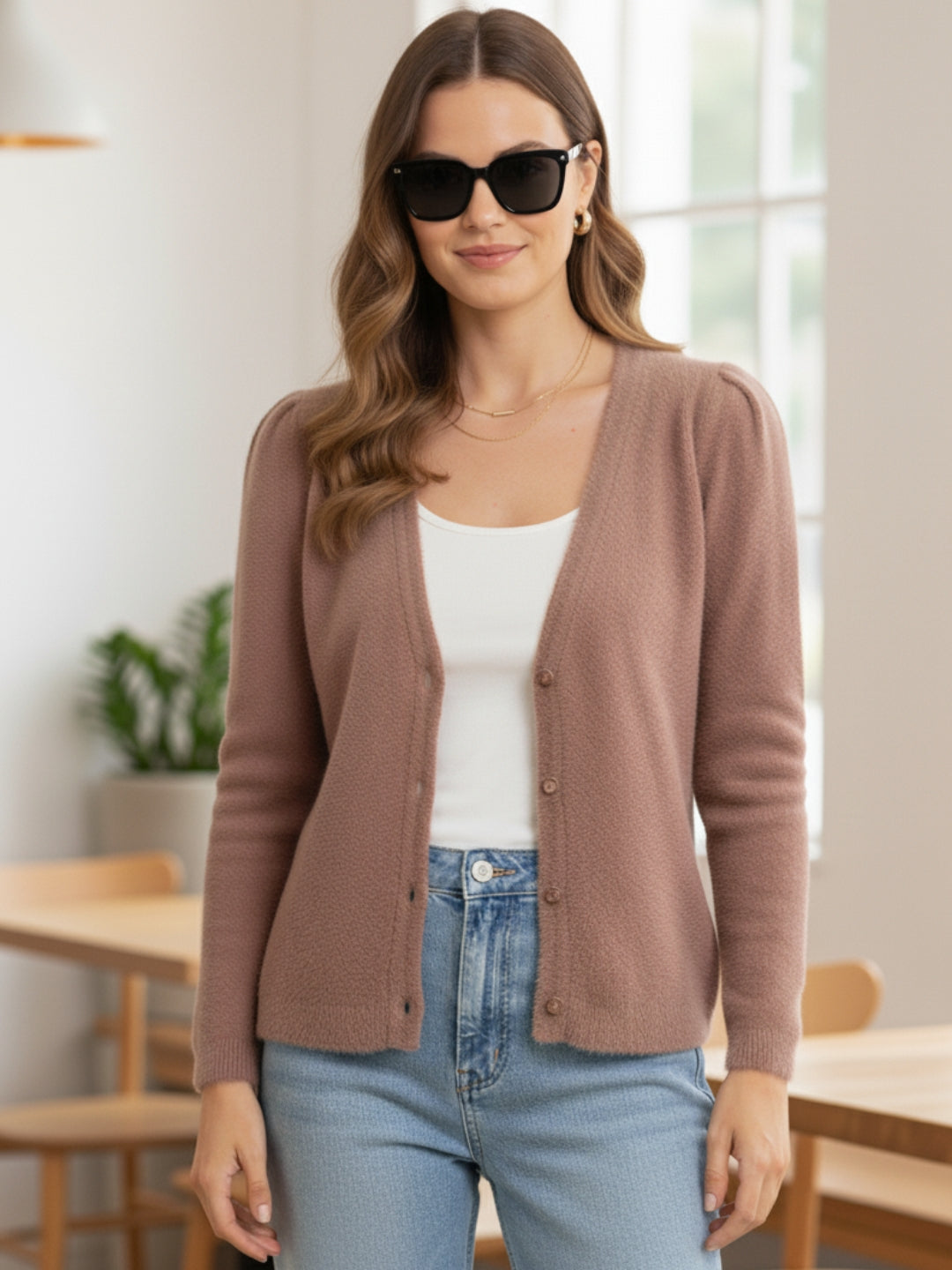 Women's long Cardigans in peach color, featuring full sleeves and a classic v neckline, perfect for winter wear.