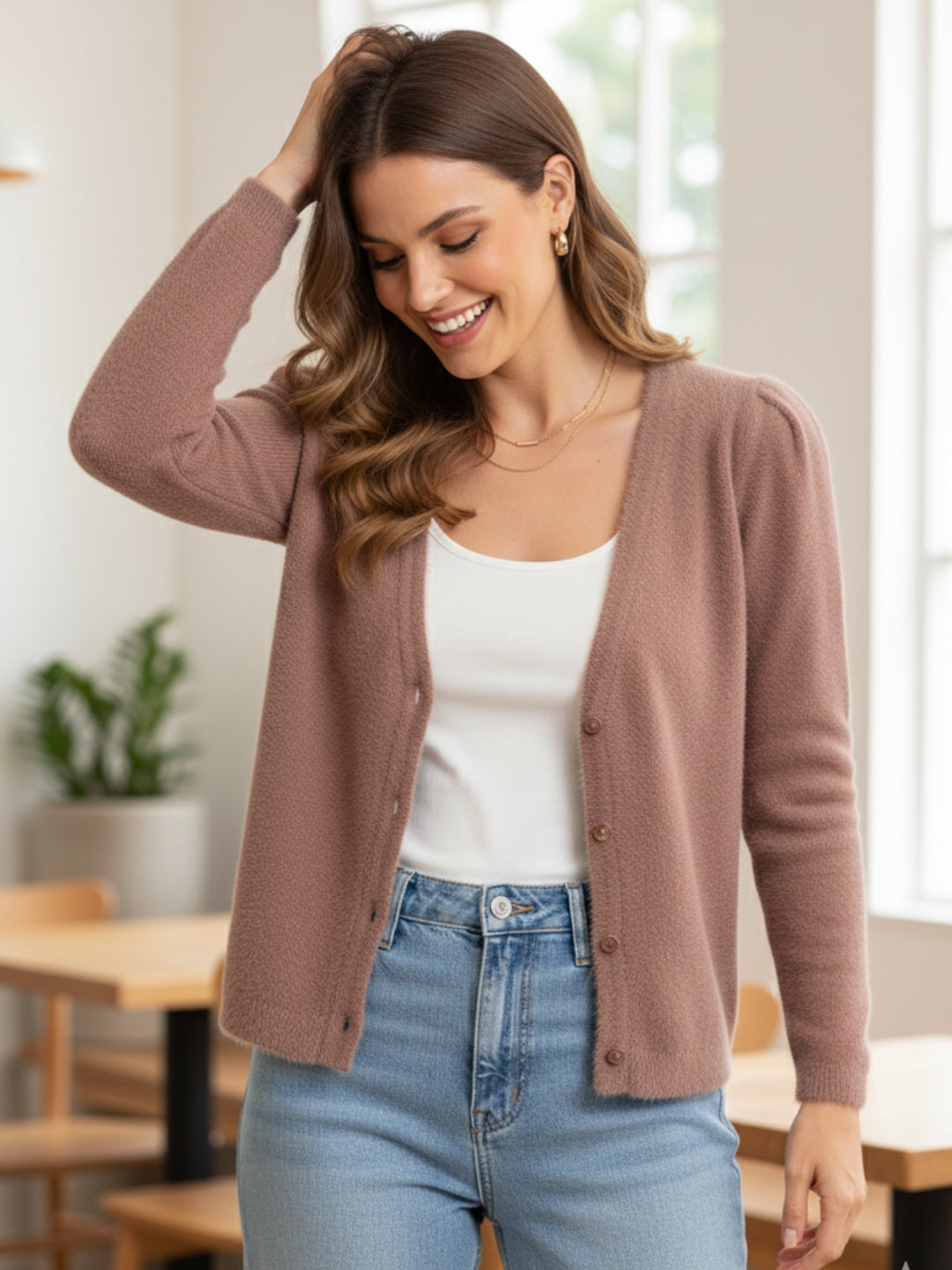 Women's long Cardigans in soft peach hair wool blend, featuring full sleeves and a classic v neckline for winter wear.
