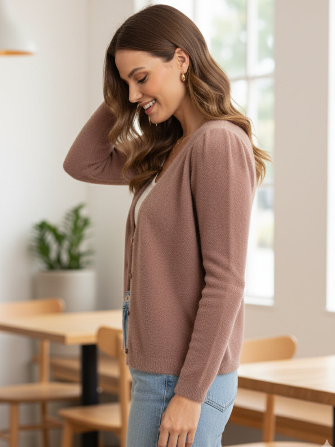 Women's long Cardigans in peach color, featuring a soft hair-wool blend material and full sleeves with a V neckline.